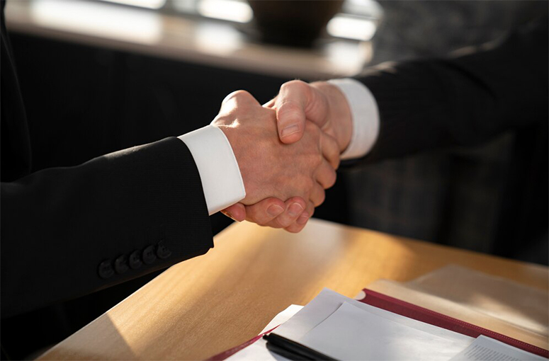 close up business people shaking hands 23 2149271696